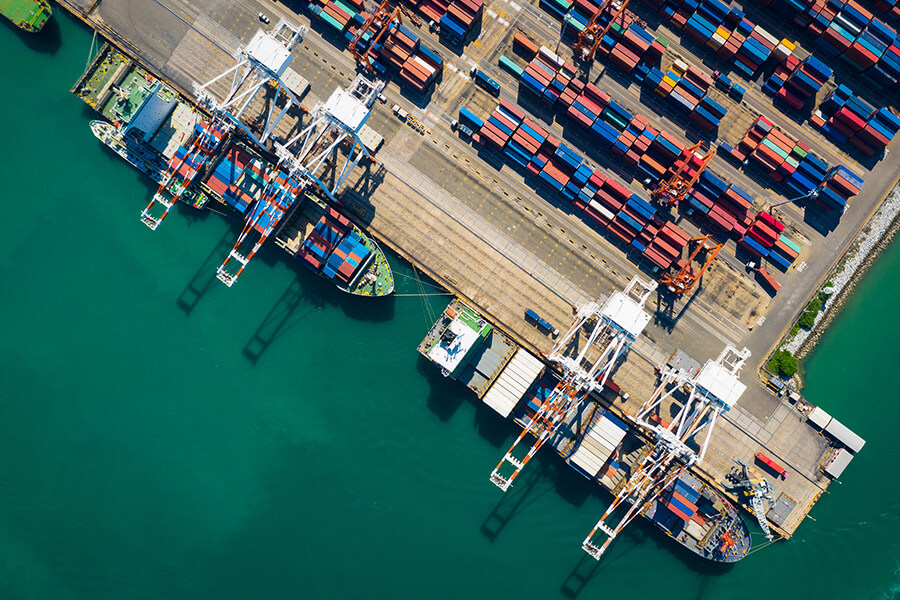 Ships and containers with export goods at a port